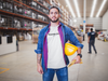 happy-worker-wearing-a-t-shirt-mockup-at-the-warehouse-a20389